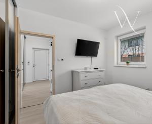 Na predaj 2-izbový byt so záhradkou a vlastným parkovacím miestom