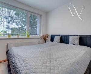 HRUBÁ BORŠA, OKR. SENEC - NA PREDAJ 4 izbový byt s vlastným kúrením a garážou.